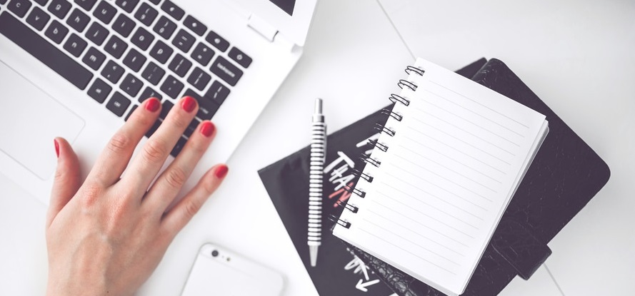 woman-hand-smartphone-desk-large